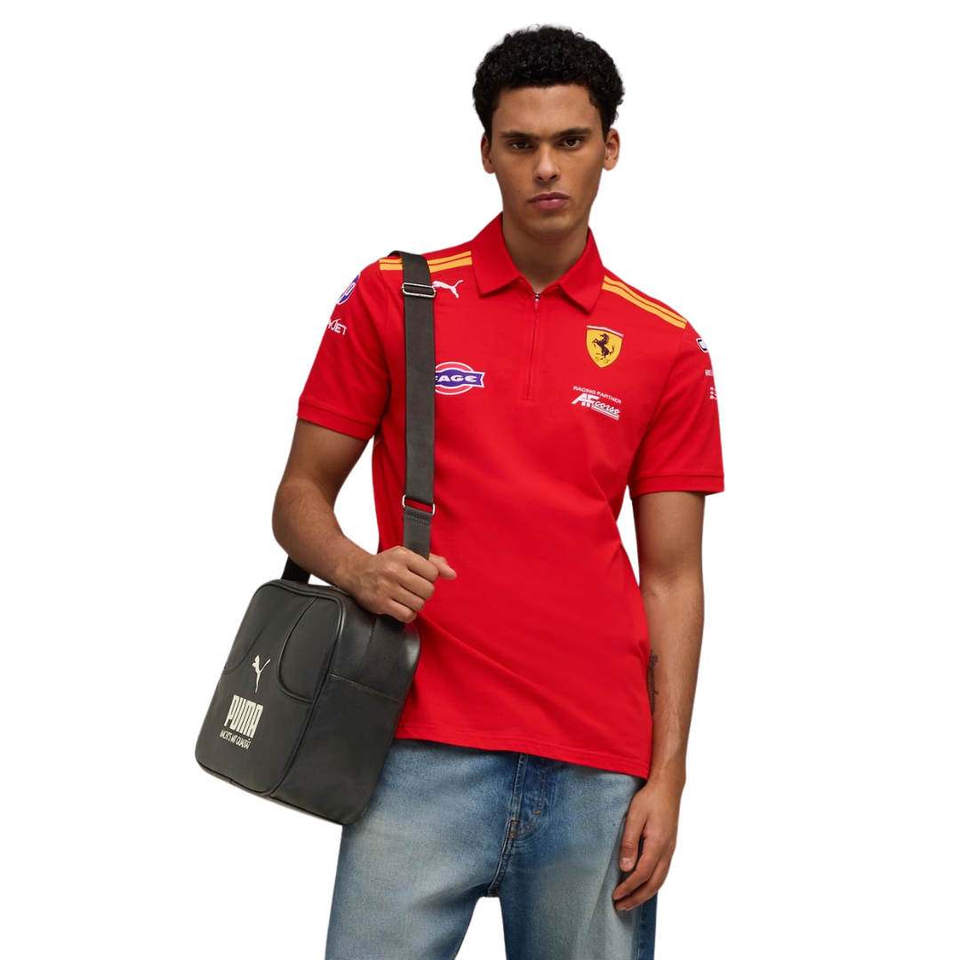 A red Ferrari Hypercar 2026 team polo shirt featuring a classic collar with yellow shoulder stripes, a short zipper placket, and official partner logos including FAGE and AF Corse across the chest.