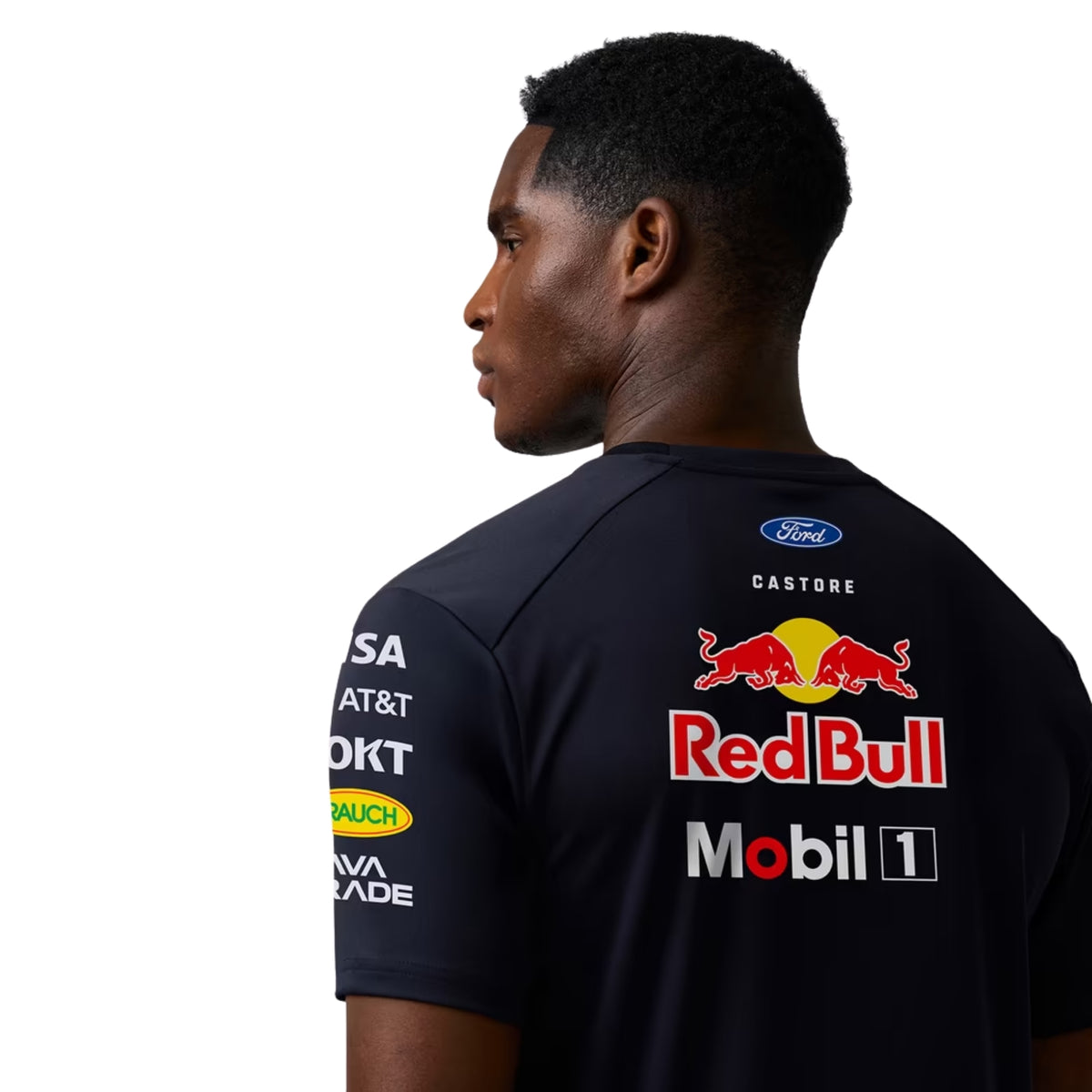 A navy blue and royal blue Oracle Red Bull Racing 2026 team t-shirt featuring a digital camouflage pattern, a crew neck, black sleeves, and prominent partner logos including TAG Heuer, Mobil 1, Ford Racing, and Oracle across the chest.