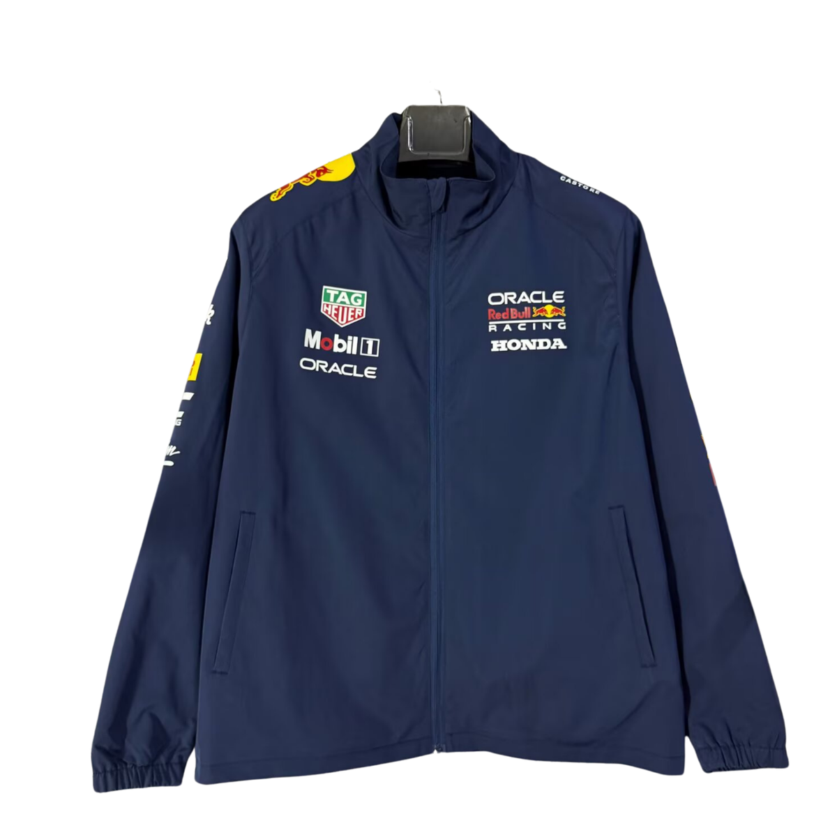 A dark blue Oracle Red Bull Racing 2026 team windbreaker jacket featuring a full front zipper, stand-up collar, and official partner logos including TAG Heuer, Mobil 1, Oracle, and Honda across the chest.