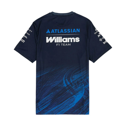 A navy blue and royal blue Williams Racing 2026 replica tech t-shirt featuring a crew neck, dynamic brushstroke graphics on the lower front, and official partner logos including Atlassian Williams F1 Team, Komatsu, Gulf, and Duracell across the chest.