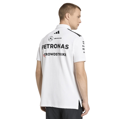 A white Mercedes-AMG Petronas 2026 team polo shirt featuring a classic collar with black shoulder striping, a button placket, and official partner logos including Mercedes-AMG, Petronas, and INEOS across the chest.
