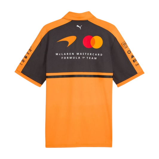 Official McLaren 2026 team polo shirt in orange and dark grey, featuring sponsor logos including OKX, Dell Technologies, and Puma.