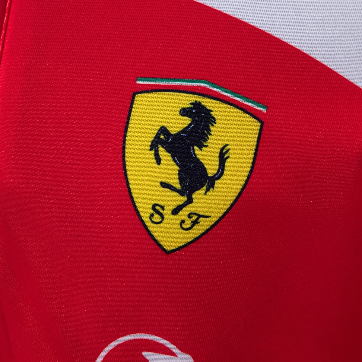 Official Scuderia Ferrari 2026 team polo shirt in red with white details, featuring the team shield and sponsor logos.