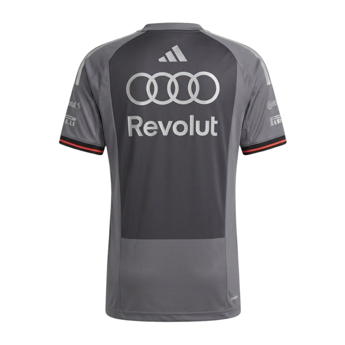 Official Audi 2026 team T-shirt in dark grey, featuring sponsor logos including Revolut, adidas, and Pirelli.