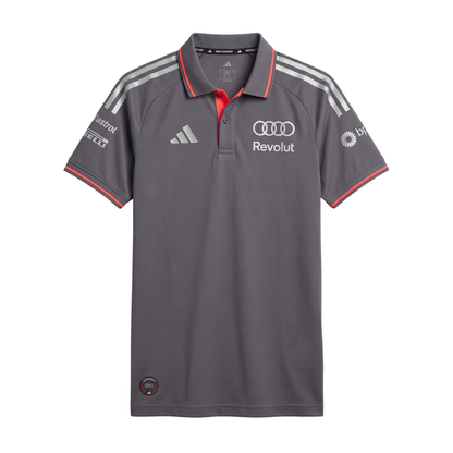 Official Audi 2026 team polo shirt in dark grey, featuring sponsor logos including Revolut, adidas, and Castrol.