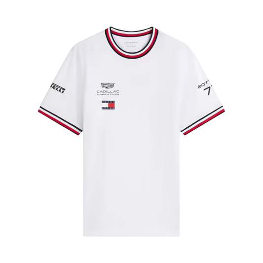 A white Tommy Hilfiger Formula 1 Team t-shirt featuring a ribbed crew neck and sleeve cuffs with red and navy stripes, and official sponsor logos including Cadillac and Pirelli across the chest and sleeves.