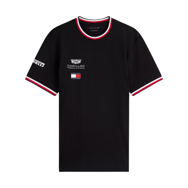 A black Tommy Hilfiger Cadillac Formula 1 Team t-shirt featuring a crew neck and sleeve cuffs with red and white stripes, and official sponsor logos including Cadillac and Pirelli across the chest and sleeves.