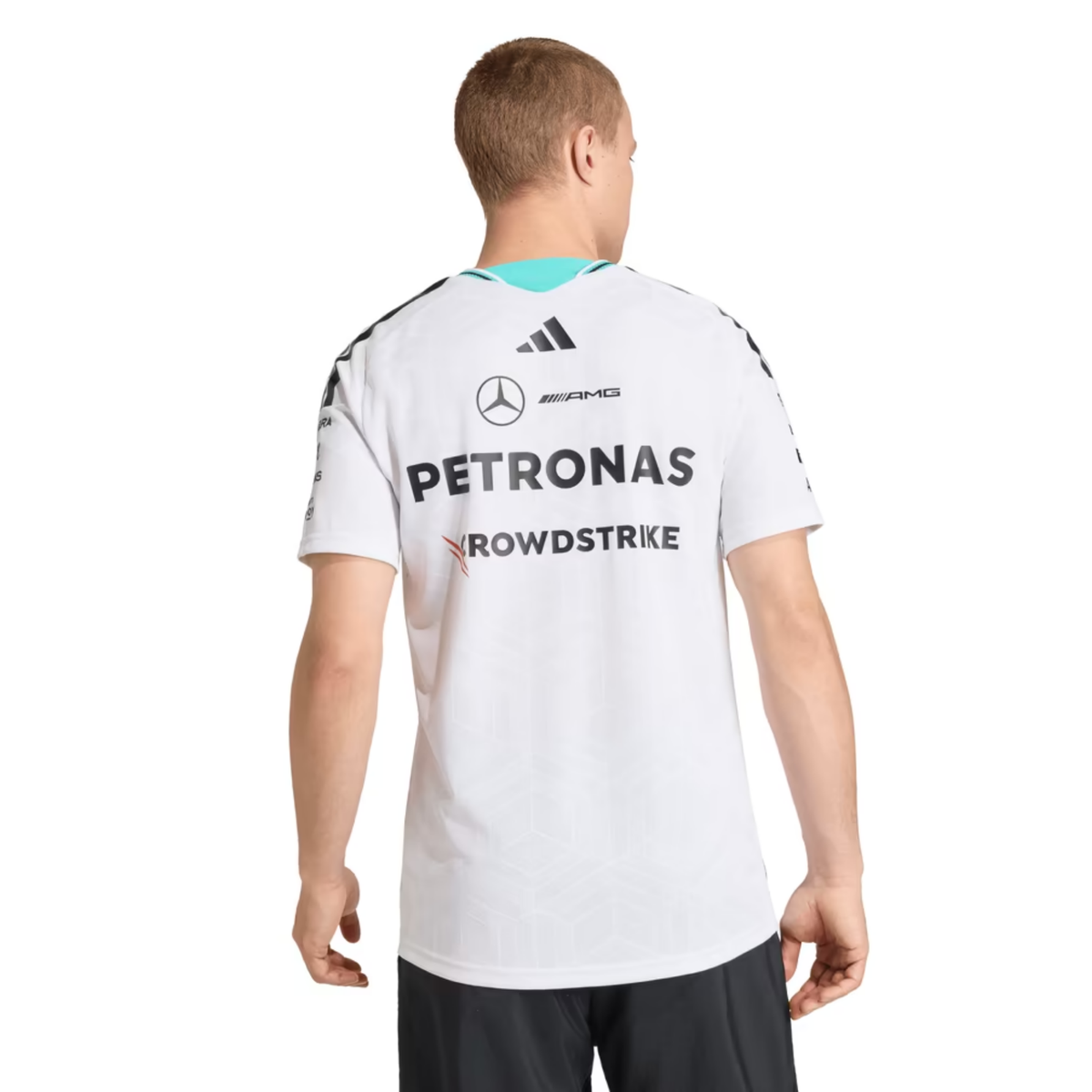 A white Mercedes-AMG Petronas 2026 team t-shirt featuring a V-neck collar with black shoulder stripes and vibrant teal inner trim, and official partner logos including Mercedes-AMG, Petronas, and UBS across the chest.