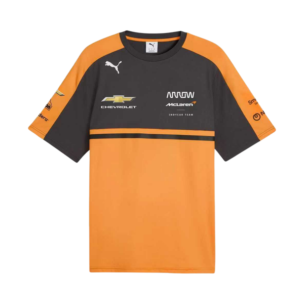 A papaya orange and charcoal Arrow McLaren IndyCar Team t-shirt featuring a crew neck, orange shoulder panels, and official partner logos including Chevrolet and Arrow McLaren IndyCar Team across the chest.