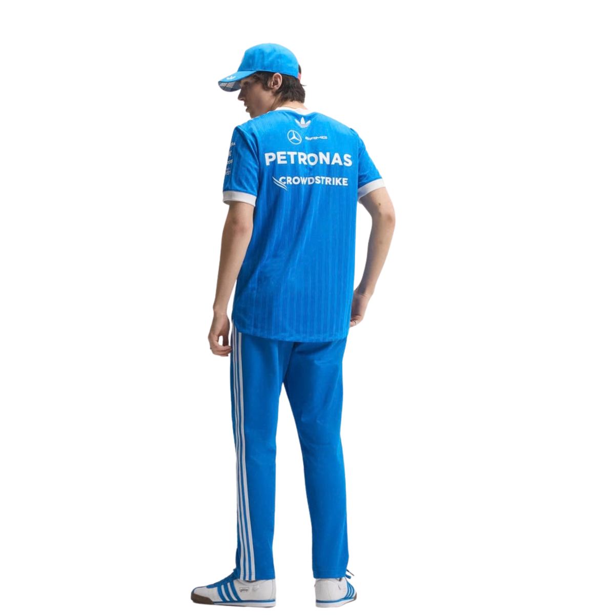 A blue and white Mercedes-AMG Petronas 2026 blue edition t-shirt featuring an all-over vertical pinstripe pattern, a white crew neck and sleeve cuffs, and official partner logos including Mercedes-AMG, Petronas, and UBS across the chest.