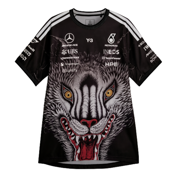 A special edition black Mercedes-AMG Petronas 2026 team t-shirt featuring a large graphic of a howling wolf's face on the front, white shoulder stripes, and official partner logos including Mercedes-AMG, Petronas, and Y-3 across the chest.