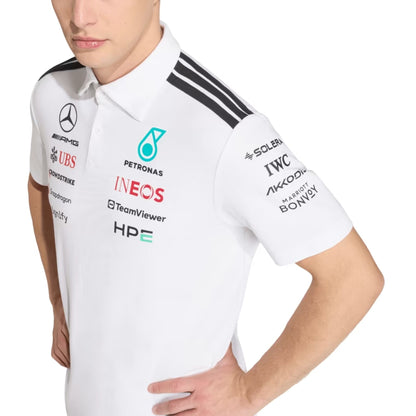 Official Mercedes-AMG Petronas 2026 team polo shirt in white, featuring sponsor logos including INEOS, UBS, and CrowdStrike.