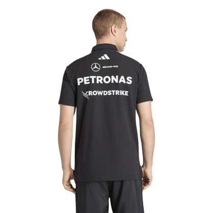 Official Mercedes-AMG Petronas 2026 team polo shirt in dark grey, featuring sponsor logos including INEOS, UBS, and CrowdStrike.