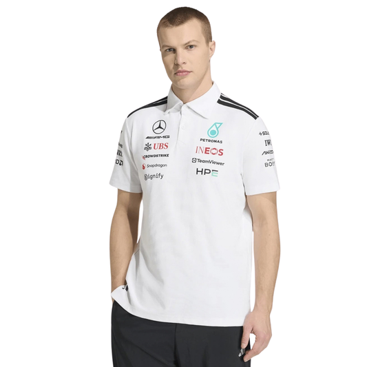 A white Mercedes-AMG Petronas 2026 team polo shirt featuring a classic collar with black shoulder striping, a button placket, and official partner logos including Mercedes-AMG, Petronas, and INEOS across the chest.