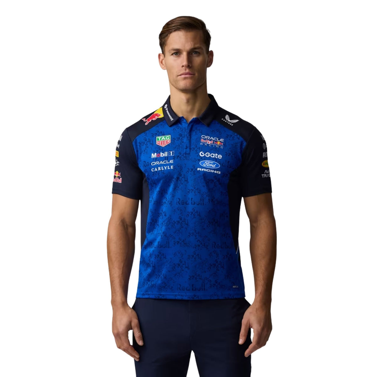 Official Oracle Red Bull Racing 2026 team polo shirt in blue and navy, featuring sponsor logos including Oracle, TAG Heuer, and Ford.