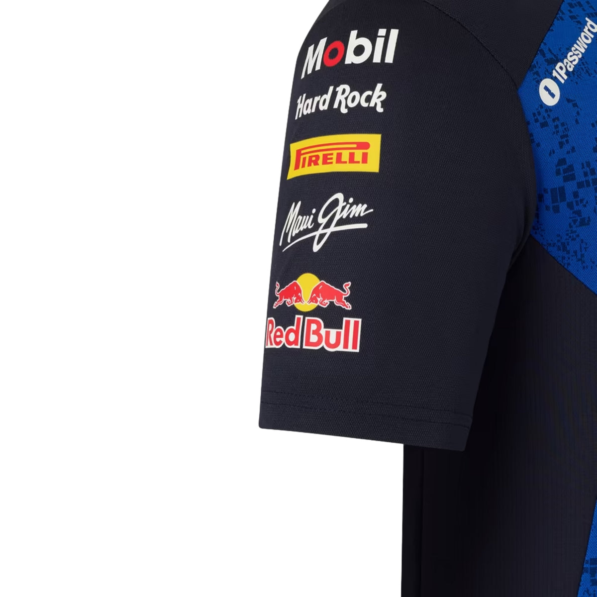 A navy blue and royal blue Oracle Red Bull Racing 2026 team t-shirt featuring a digital camouflage pattern, a crew neck, black sleeves, and prominent partner logos including TAG Heuer, Mobil 1, Ford Racing, and Oracle across the chest.