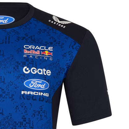 A navy blue and royal blue Oracle Red Bull Racing 2026 team t-shirt featuring a digital camouflage pattern, a crew neck, black sleeves, and prominent partner logos including TAG Heuer, Mobil 1, Ford Racing, and Oracle across the chest.