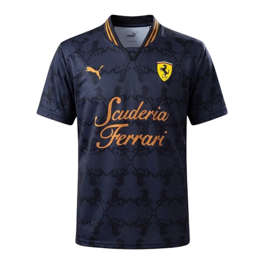 A dark gray and gold Scuderia Ferrari 2026 community t-shirt featuring a subtle all-over Prancing Horse pattern, a V-neck collar, and the classic "Scuderia Ferrari" script across the chest.