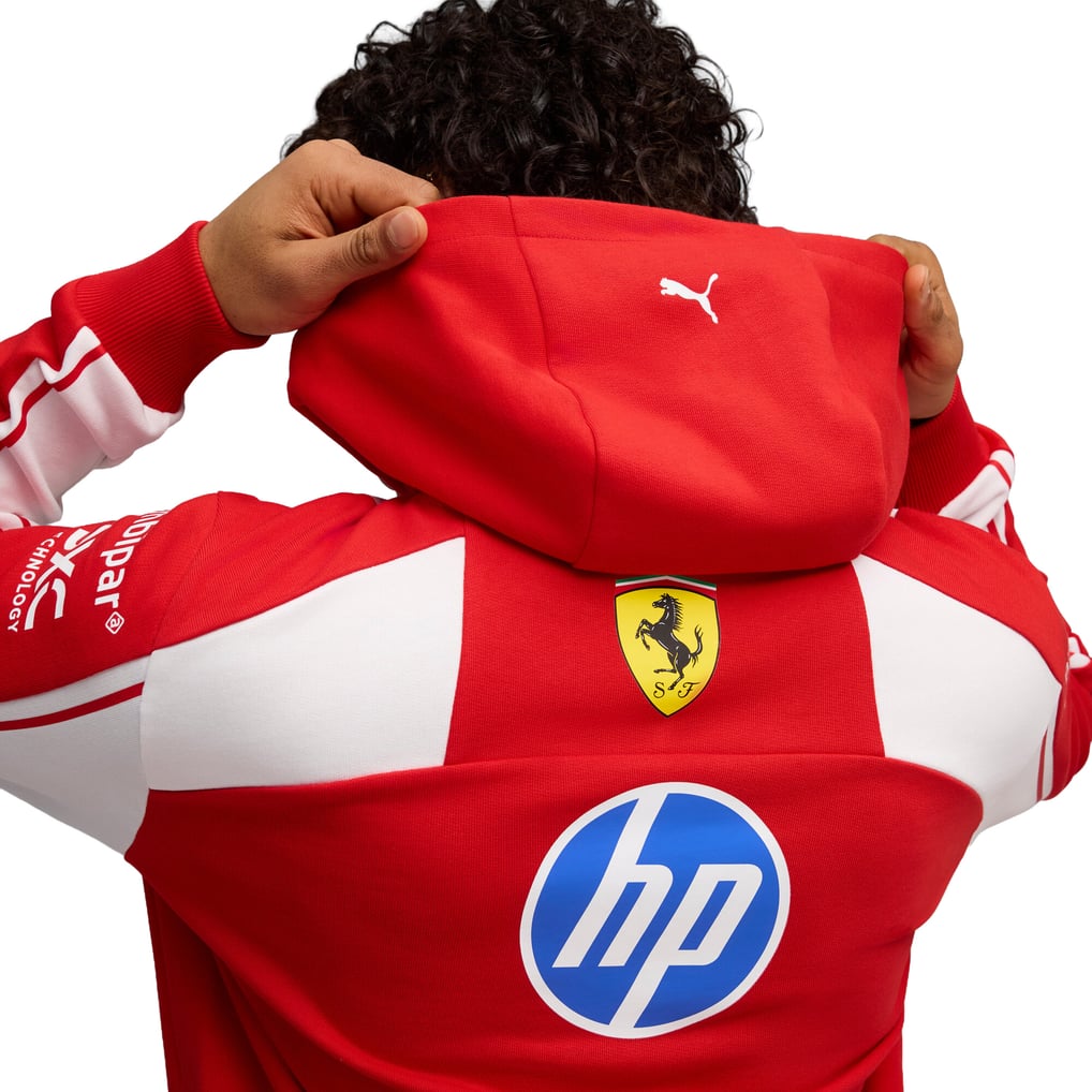 Official Scuderia Ferrari 2026 team hoodie in red and white, featuring sponsor logos including HP, Shell, and UniCredit.