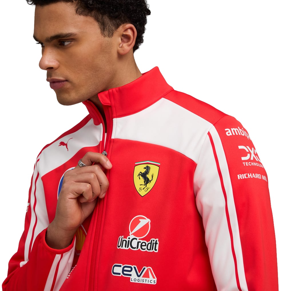 Official Scuderia Ferrari 2026 team jacket in red and white, featuring sponsor logos including HP, Shell, and UniCredit.