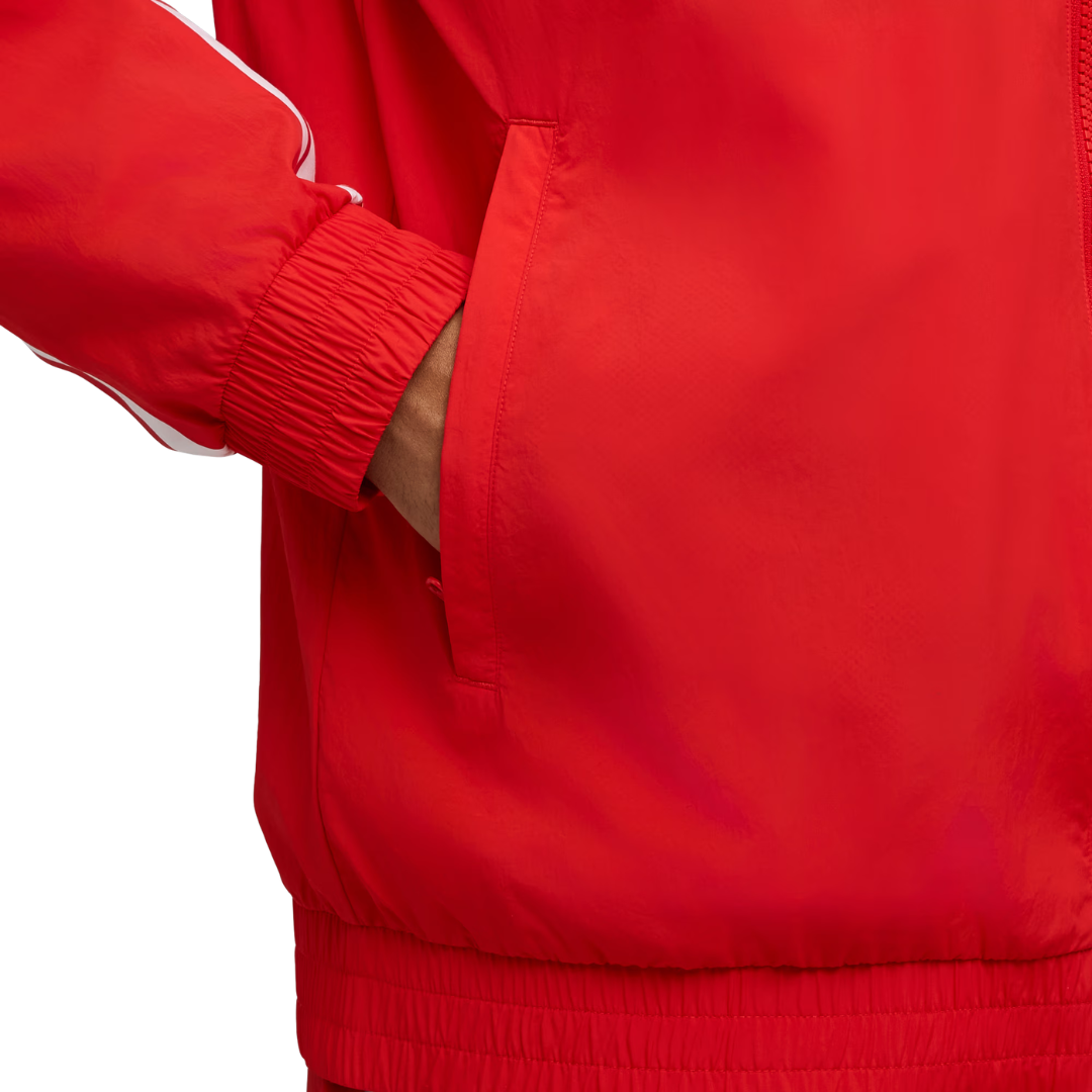A red and white Scuderia Ferrari 2026 team windbreaker jacket and matching pants, featuring a full front zipper and sponsor logos including HP and Shell on the chest.