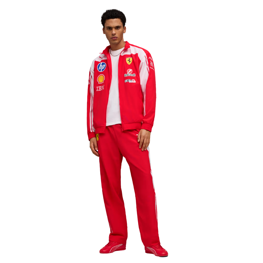 A red and white Scuderia Ferrari 2026 team windbreaker jacket and matching pants, featuring a full front zipper and sponsor logos including HP and Shell on the chest.