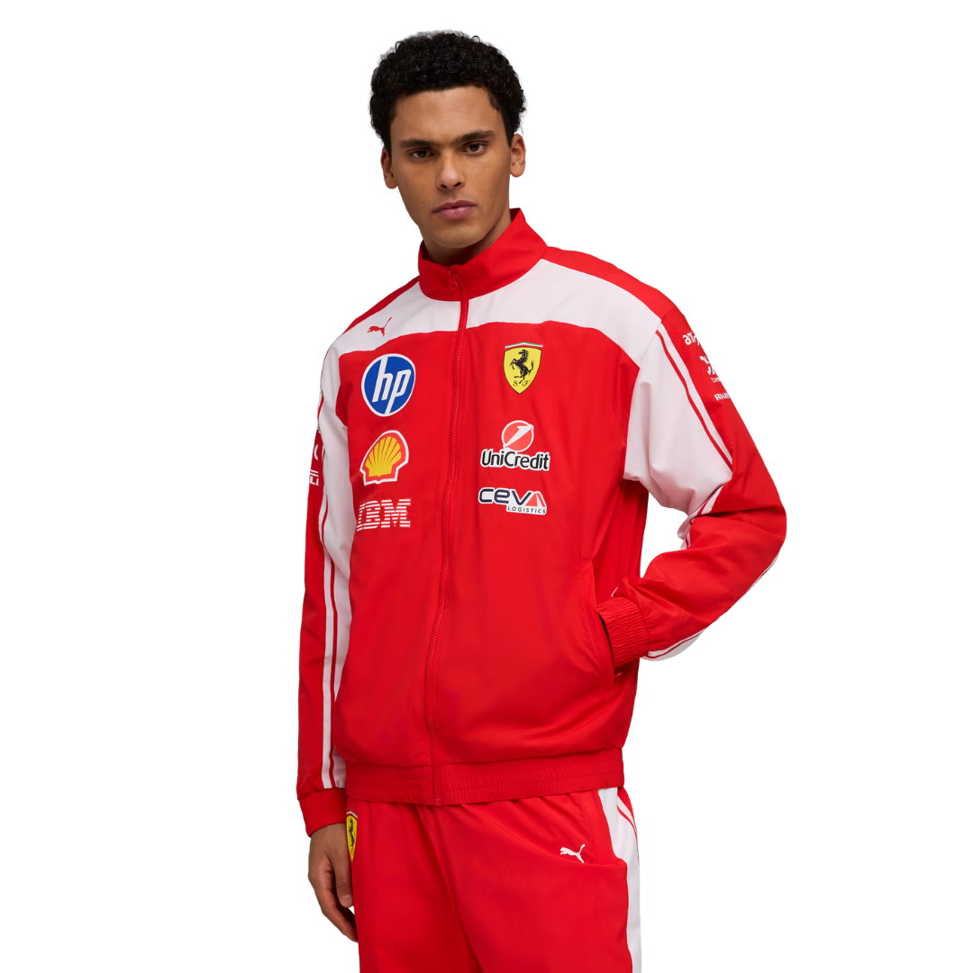 A red and white Scuderia Ferrari 2026 team windbreaker jacket and matching pants, featuring a full front zipper and sponsor logos including HP and Shell on the chest.
