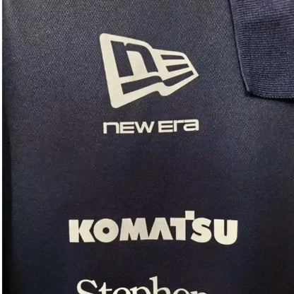 Official Williams Racing 2026 team polo shirt in navy blue, featuring sponsor logos including Gulf, Komatsu, and Duracell.