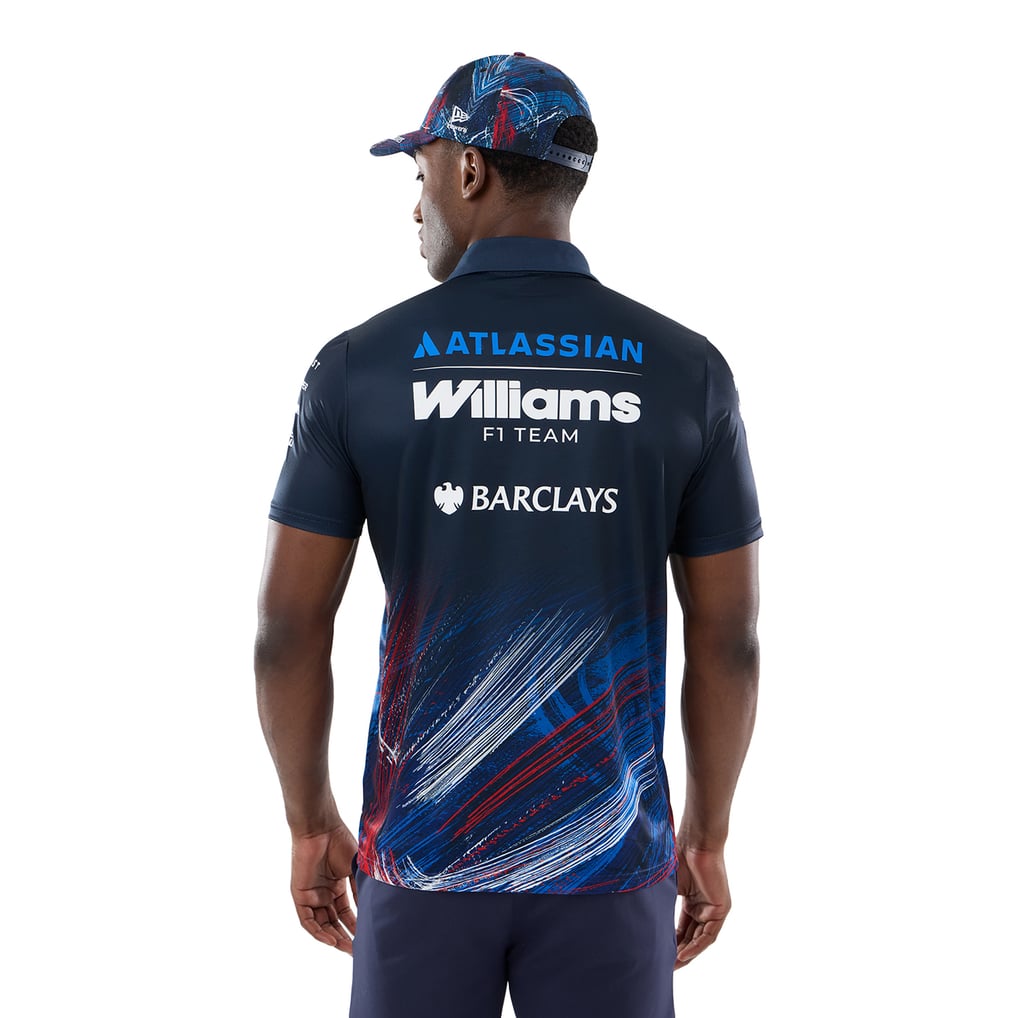 Official Williams Racing 2026 team polo shirt in navy blue and red, featuring sponsor logos including Gulf, Komatsu, and Duracell.