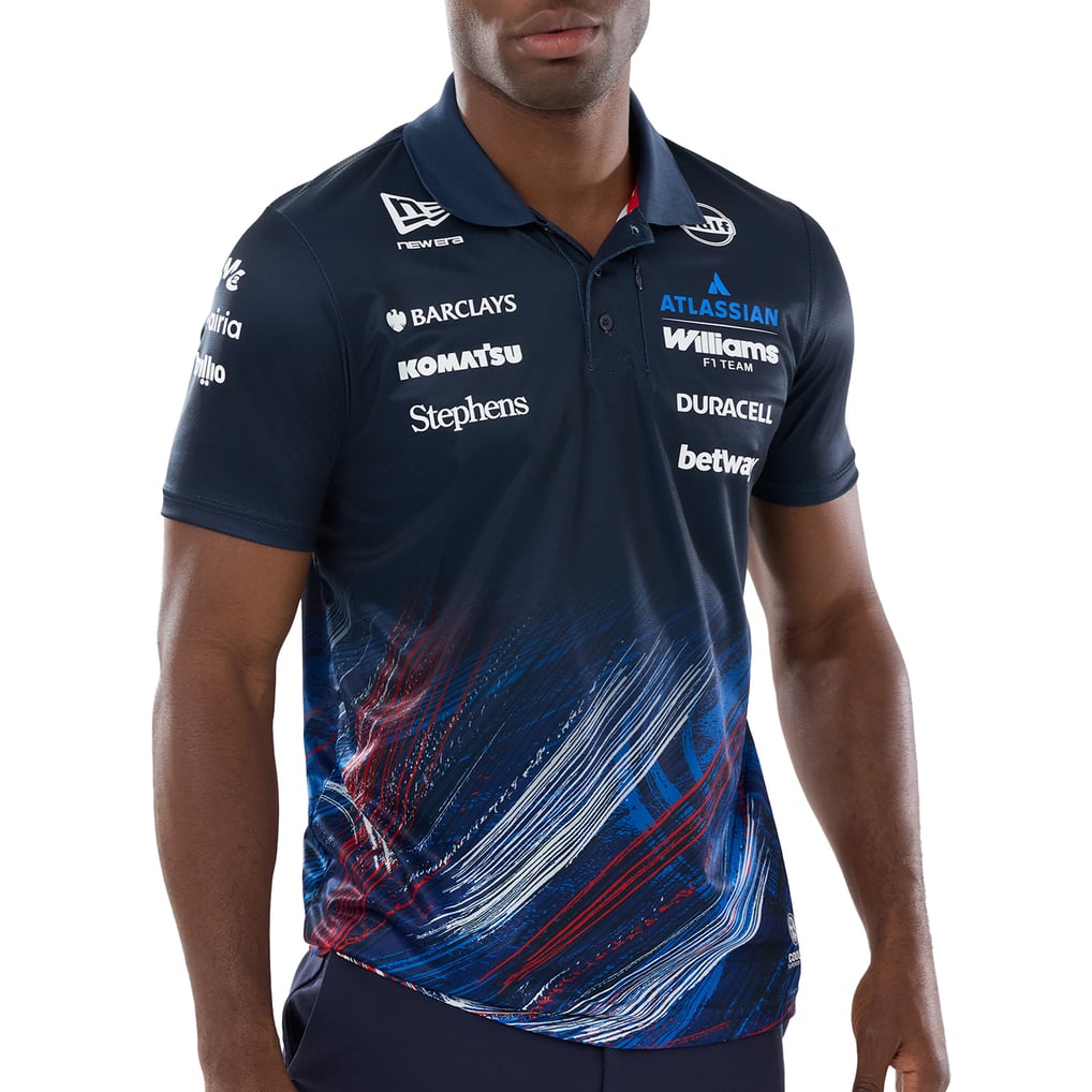 Official Williams Racing 2026 team polo shirt in navy blue and red, featuring sponsor logos including Gulf, Komatsu, and Duracell.