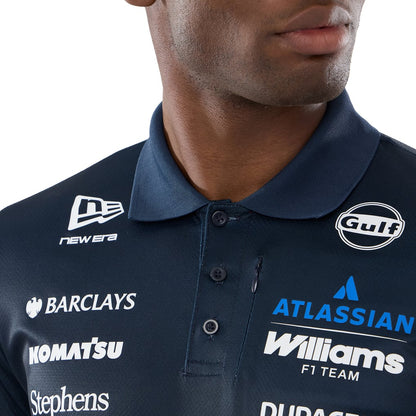 Official Williams Racing 2026 team polo shirt in navy blue and red, featuring sponsor logos including Gulf, Komatsu, and Duracell.