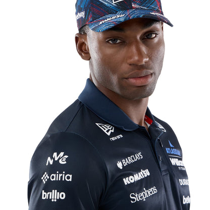 Official Williams Racing 2026 team polo shirt in navy blue and red, featuring sponsor logos including Gulf, Komatsu, and Duracell.